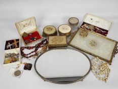 A quantity of dressing table items and a collection of costume jewellery.