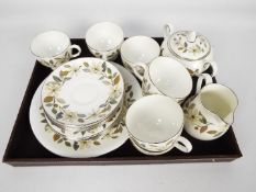 A collection of Wedgwood tea wares with floral and foliate decoration, 23 pieces.