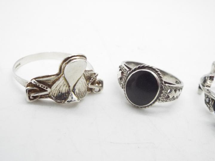 Four silver and white metal rings, sizes from P to Z. - Image 2 of 3