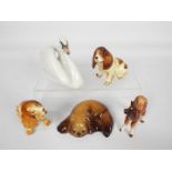 Four animal figures comprising two W R Midwinter dogs,