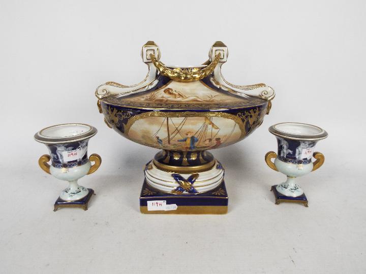 A Meissen style garniture in blue and gi