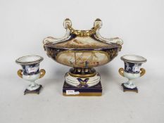 A Meissen style garniture in blue and gi