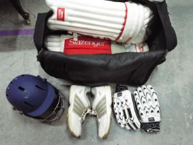 A quantity of cricket equipment to inclu