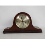 A mantel clock with Arabic numerals to a