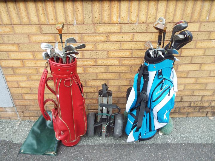 A collection of golf clubs and accessori