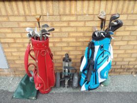 A collection of golf clubs and accessori