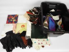 A quantity of lady's accessories to include silk and similar scarves, gloves and other.