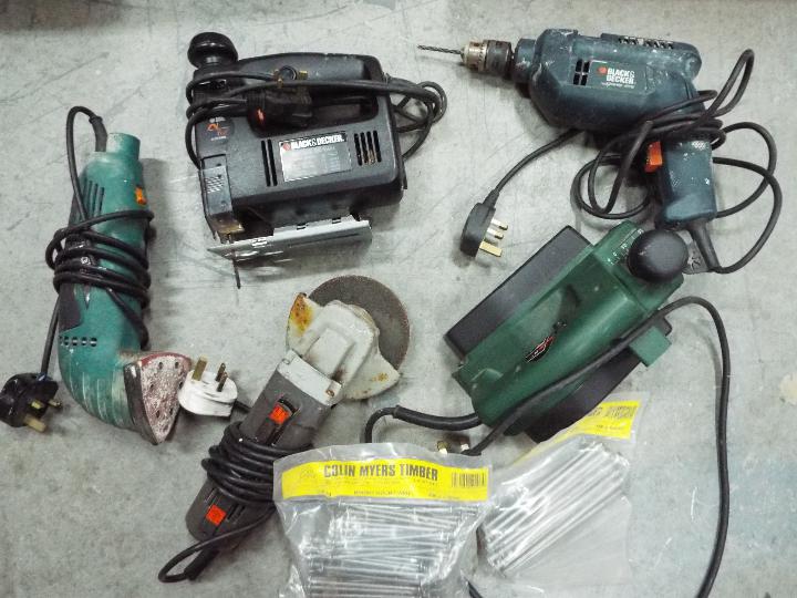 A collection of power tools to include d