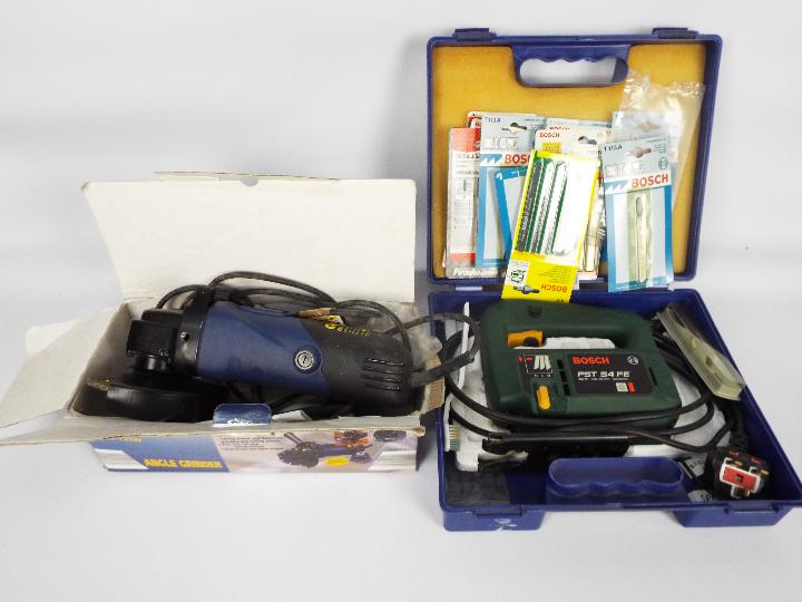 A Bosch jigsaw in carry case and a Power Craft angle grinder.