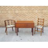 A drop leaf table measuring approximately 71 cm x 95 cm x 55 cm (105 cm) and two chairs.
