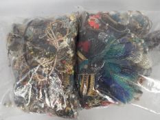 Costume Jewellery - Two clear, sealed bags of unsorted costume jewellery, approximately 10kg.