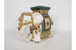 A Chinese style stand in the form of a caparisoned elephant,