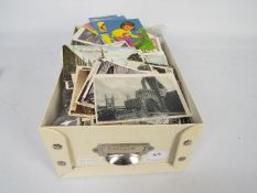Deltiology - A box of UK and foreign postcards.