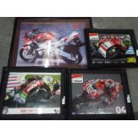 Four framed photographic prints of motor