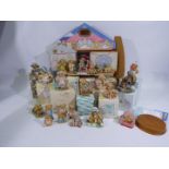 A Cherished Teddies display stand and a collection of predominantly boxed Cherished Teddies.