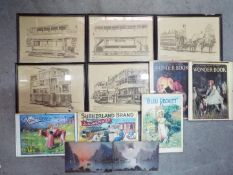 A collection of advertising prints and framed prints of trams.