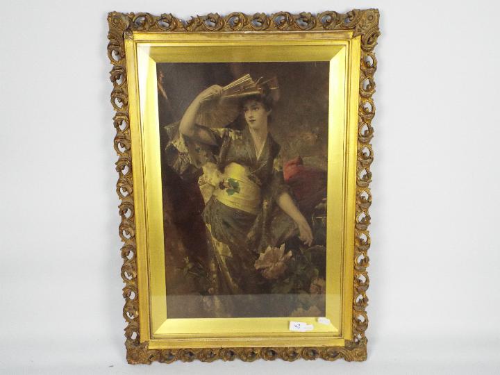 A gilt framed print depicting a lady in