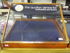 A table top jewellery display with hinged lid,