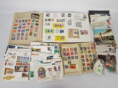 Philately - Three albums containing stamps, loose stamps,