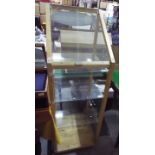 A pine framed display cabinet with glass shelves, approximately 137 cm x 46 cm x 48.