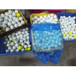 A large quantity of golf balls, four boxes.