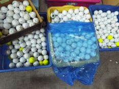 A large quantity of golf balls, four boxes.