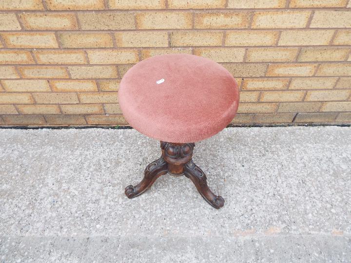 A rise and fall piano stool on carved tripod supports. - Image 2 of 3