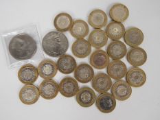 A collection of modern coins comprising twenty four £2 coins (all 1997) and two £5 coins (one 1999