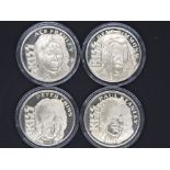 Collectible - Four collectible coins / medallions struck by Liberty mint in the USA.