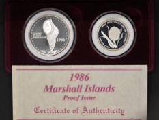 Silver - Marshall Islands proof issue one dollar and one half dollar coins - A 1 troy oz (31.