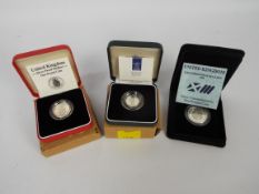 Silver coins comprising a 1990 piedfort five pence coin,