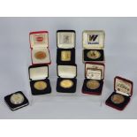 Collectable- Eight collectible coins / medallions struck by Liberty mint in the USA.