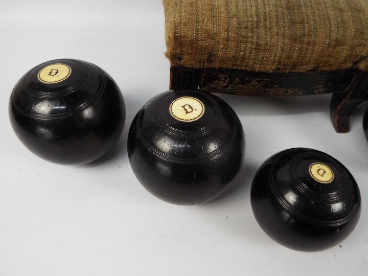 A collection of bowls and an antique foot stool. - Image 2 of 3