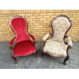 Two mahogany framed, upholstered armchairs with carved decoration.