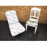 A white painted chair with upholstered s