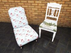 A white painted chair with upholstered s