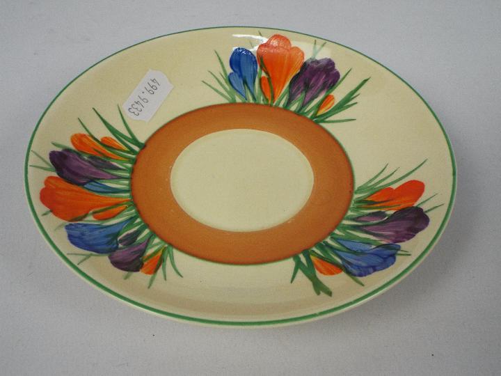 Clarice Cliff - a teacup and saucer hand painted in the Crocus pattern, Clarice Cliff, - Image 3 of 5