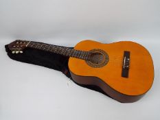 A Stagg classical guitar, model C430, in soft case.