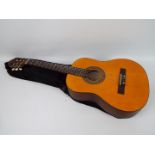 A Stagg classical guitar, model C430, in soft case.