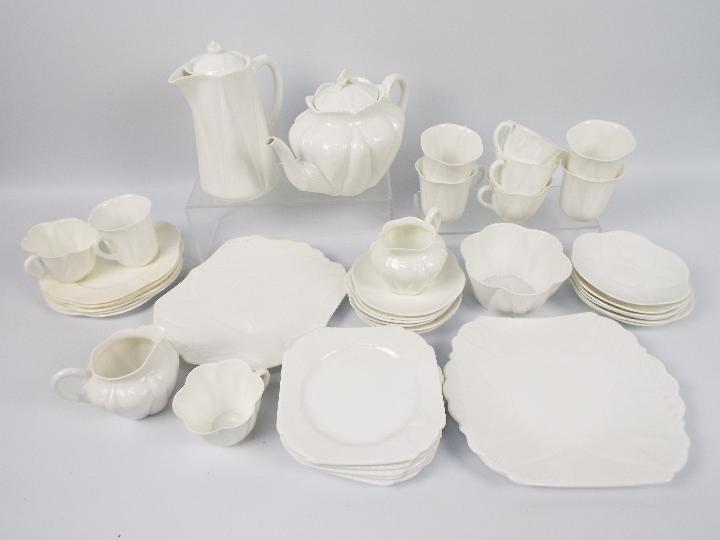 Shelley - A collection of white glaze, Dainty tea wares, in excess of forty pieces.