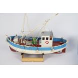 An unmarked Radio Controlled model of a fishing vessel.