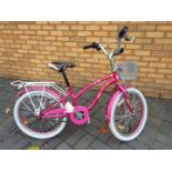 A pink girl's bike with 20" wheels.