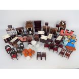 Unmarked - A quantity of dolls house furniture including a three piece suite,