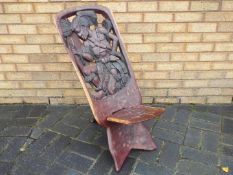 A carved wood, tribal palaver chair.