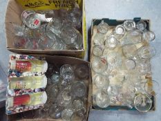 A large collection of predominantly branded drinking glasses, three boxes.