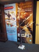 A 200 cm pre-lit LED tree with 120 lights in snow effect,