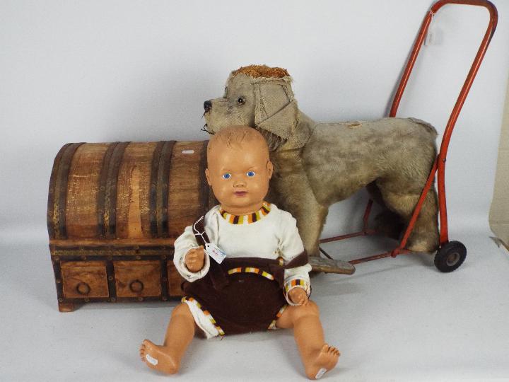 Triang, Other - An unboxed and unmarked vintage child mannequin doll with a Triang Push-Along-Dog.