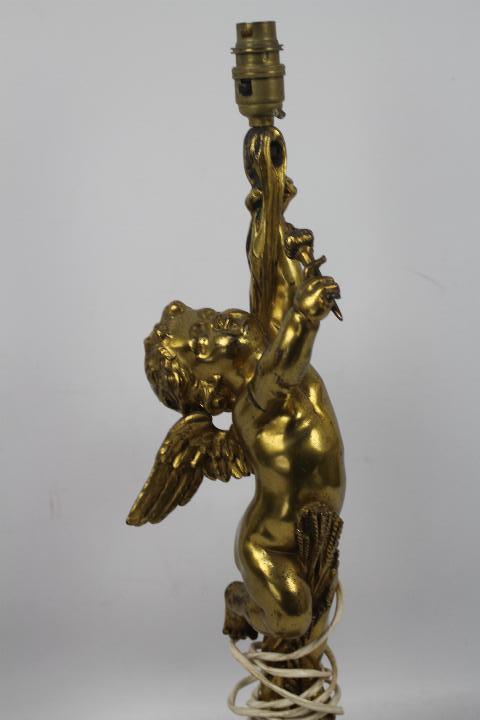 A gilt metal table lamp in the form of a putto, approximately 56 cm (h). - Image 2 of 3