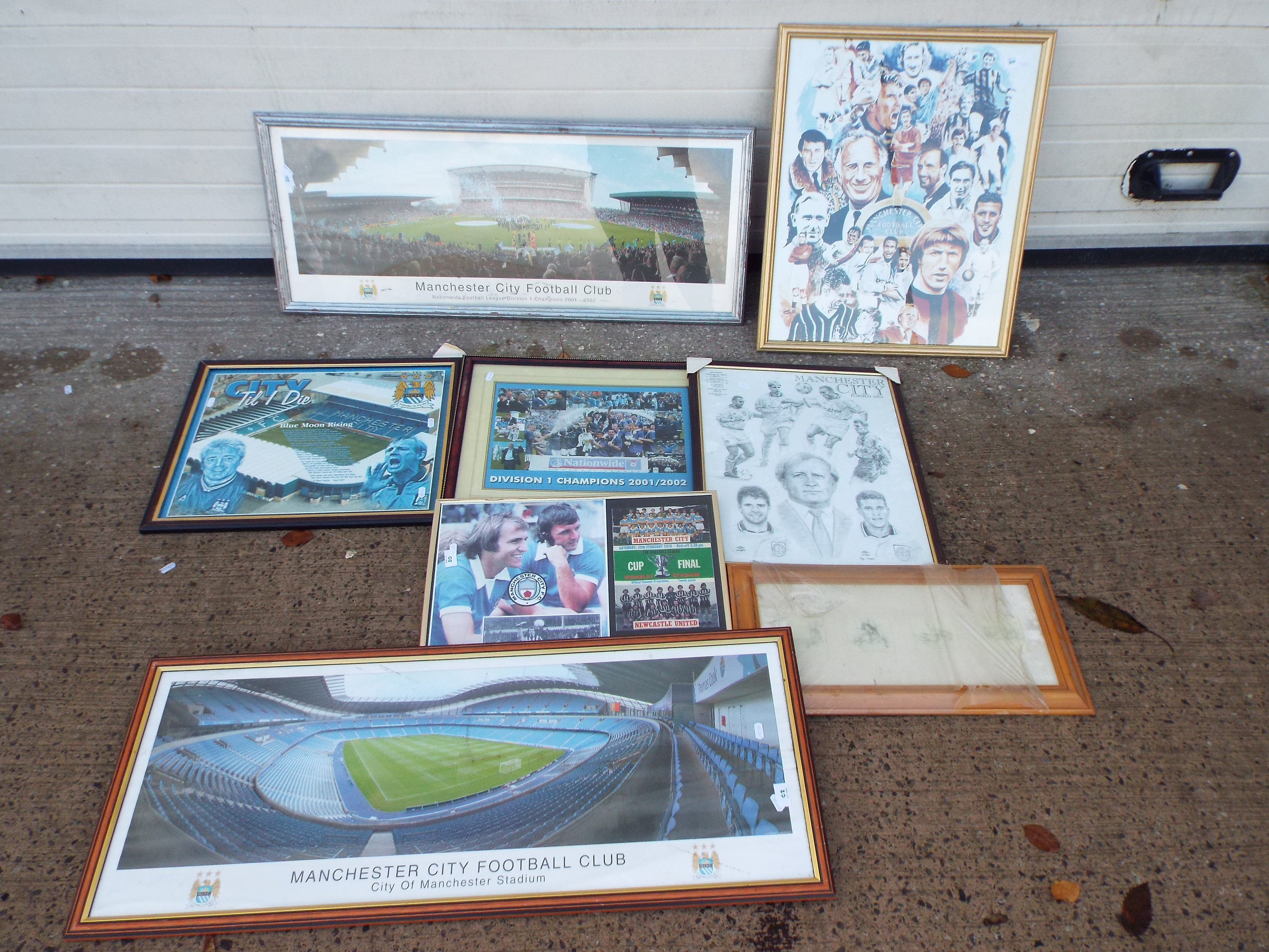 A collection of framed Manchester City r