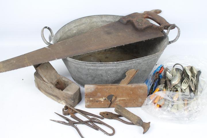 A small quantity of vintage tools, a vintage baby bath and a quantity of flatware.